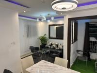 TV a/nebo společenská místnost v ubytování Moderno Penthouse
