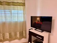 TV a/nebo společenská místnost v ubytování Moderno Penthouse