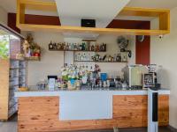 a kitchen with a counter with flowers on it at The Kasih Villas & Spa in Seminyak