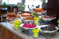 a buffet with many plates of food on a table at MPM Hotel Arsena - Ultra All Inclusive in Nesebar