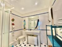 a bathroom with a sink and a toilet and a shower at La Marjolette by Welcome to Cannes in Cannes