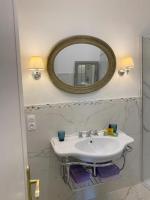 a bathroom with a sink and a mirror at Appartement Nice Port in Nice