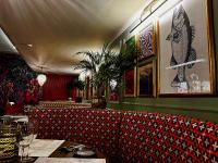 a dining room with a red and black patterned couch at Best Western New Kent Hotel in Newcastle upon Tyne