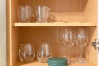 a row of wine glasses sitting on a shelf at La pépite bleue de Nanterre in Nanterre