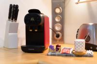 a coffee maker sitting on top of a wooden table at La pépite bleue de Nanterre in Nanterre