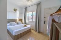 Postel nebo postele na pokoji v ubytování Maxcaly Playa