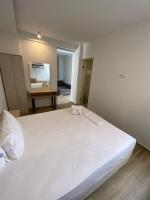 Postel nebo postele na pokoji v ubytování Coral Boutique Apartments