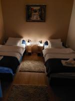 Posteľ alebo postele v izbe v ubytovaní Apartman SAN