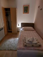 Posteľ alebo postele v izbe v ubytovaní Apartman SAN