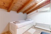 Posteľ alebo postele v izbe v ubytovaní Casa Ginevra