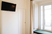 Televizorius ir (arba) pramog&#x173; centras apgyvendinimo &#x12F;staigoje Spacious apartment at the foot of Montmartre