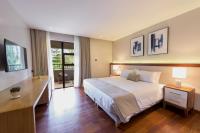 a bedroom with a large bed and a desk with a lamp at Deerpark Luxury Stays in Nairobi