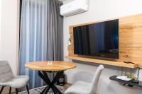 TV a/nebo společenská místnost v ubytování Apartmenthaus Oborishte