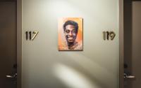 a picture of a man hanging on a door at AMERON Hamburg Hotel Speicherstadt in Hamburg