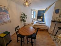 a small room with a table and a bed at Ton Petit Studio - Le 62 - Coeur de Ville in Mulhouse