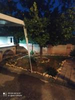 a garden in front of a house at night at Casa del Sol in Arónion