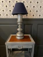 a table with a lamp on top of it at La Maison Bizienne Guérande in Guérande