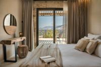 Posteľ alebo postele v izbe v ubytovaní Adrias Villa Kefalonia