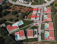 an aerial view of a building complex with houses at Villa Amarylis - Ionian Treasure Villas in Kefallonia
