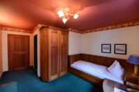 A bed or beds in a room at Gasthof Hotel Zweimüller