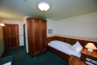 A bed or beds in a room at Gasthof Hotel Zweimüller