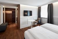 A bed or beds in a room at Gasthof Hotel Zweimüller