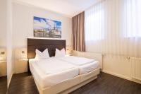 Postel nebo postele na pokoji v ubytování Viva Hotel Lübeck