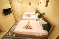 Postel nebo postele na pokoji v ubytování Locanda Pyramids Hotel
