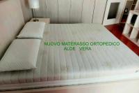 A bed or beds in a room at Casa Moretti