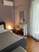 Postel nebo postele na pokoji v ubytování DARSISS 1 - Museum Apartment