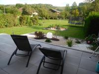 a patio with two chairs and a fire pit in a yard at Guestroom Arbigny-sous-Varennes, 2 pièces, 4 personnes - FR-1-611-72 