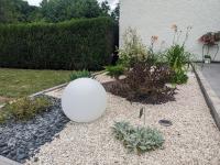 a white sphere sitting in the middle of a garden at Guestroom Arbigny-sous-Varennes, 2 pièces, 4 personnes - FR-1-611-72 