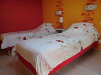 two twin beds in a room with yellow walls at Guestroom Arbigny-sous-Varennes, 2 pièces, 4 personnes - FR-1-611-72 