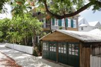 a green garage in front of a house at Ridley House - Key West Historic Inns in Key West