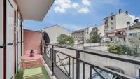 a balcony with a view of a street and buildings at Chic apart with parking and balcony near Paris in Aubervilliers