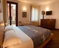 Posteľ alebo postele v izbe v ubytovaní Grimaldi Apartments Cannaregio