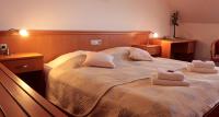 Postel nebo postele na pokoji v ubytování Hotel U Beránka Náchod