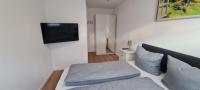 Postel nebo postele na pokoji v ubytování Noahs Apartments