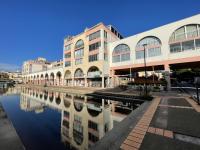 a building next to a body of water at Studio Sète, 1 pièce, 4 personnes - FR-1-338-406 in Sète