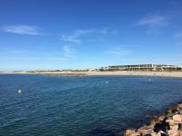 a large body of water with a beach in the background at Studio Sète, 1 pièce, 4 personnes - FR-1-338-406 in Sète