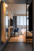 Chengdu Desti Youth Park Hostel TaiKooLiにあるベッド