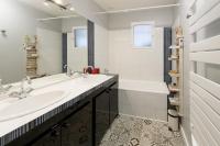 a white bathroom with two sinks and a tub at L&#39;Orinss - Maison avec jacuzzi in Saint-Orens-de-Gameville
