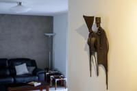 a violin hanging on a door in a living room at L&#39;Orinss - Maison avec jacuzzi in Saint-Orens-de-Gameville