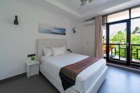 Postel nebo postele na pokoji v ubytování Silver Oasis Maldives