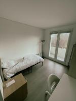 Łóżko lub łóżka w pokoju w obiekcie Appartement Proche U Arena et La Défense
