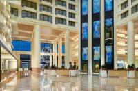 a lobby of a building with large windows at Orlando World Center Marriott in Orlando