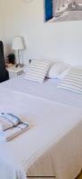 Postel nebo postele na pokoji v ubytování Jávea Villa entière piscine et cuisine d'été à pinosol