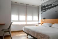 Postel nebo postele na pokoji v ubytování Hotel Dabeleira