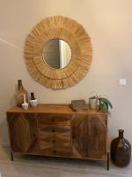 a wooden dresser with a mirror on a wall at Un paradis avec piscine au cœur du village in Cassis