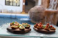 two plates of food sitting on a glass table at Sanafir Hotel - El Pacha Suites Sharm - Adults Only in Sharm El Sheikh